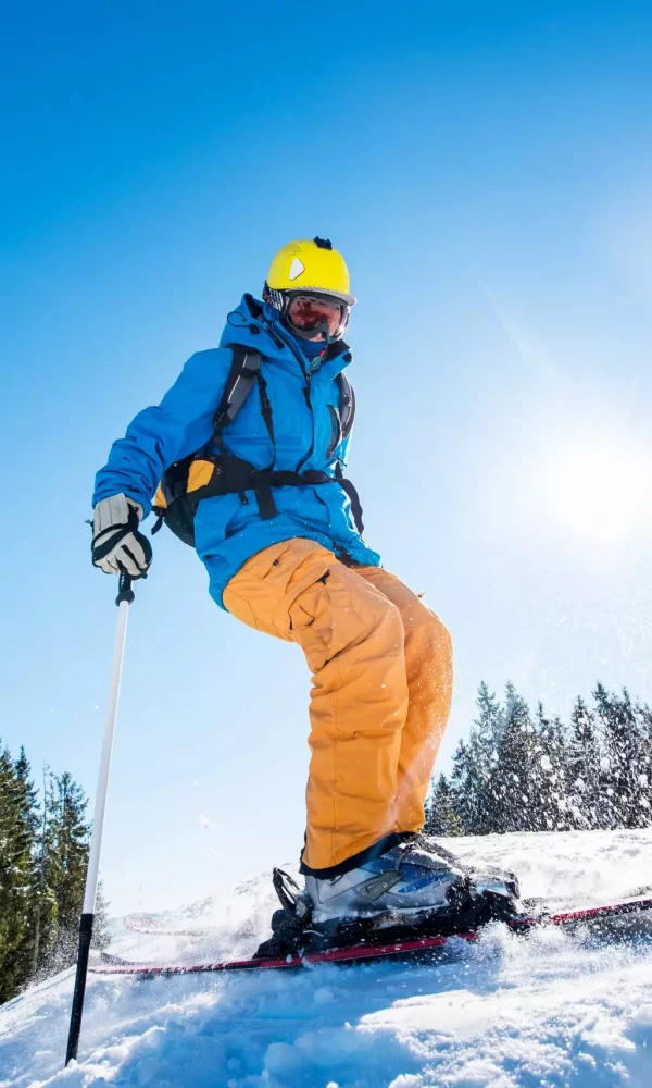 skier on slope in mountains on winter day
